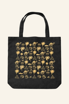 Black tote bag with gold graphic design on a white background