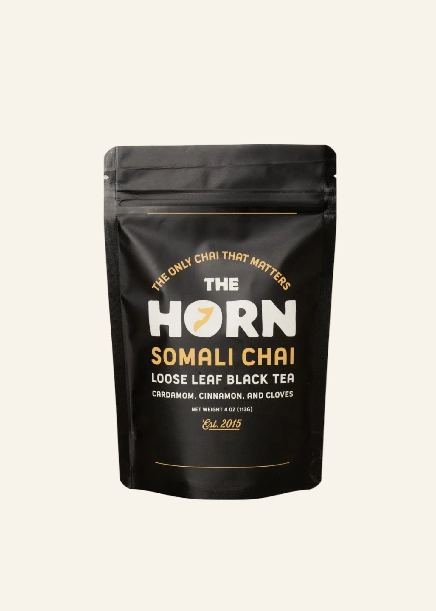 Loose leaf tea and spices package labeled 'The Horn Somali Chai' on a beige background